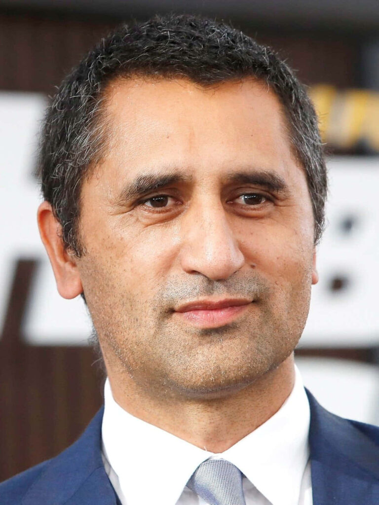 Cliff Curtis in blue suit sharp focus professional portrait natural lighting neutral background Wallpaper