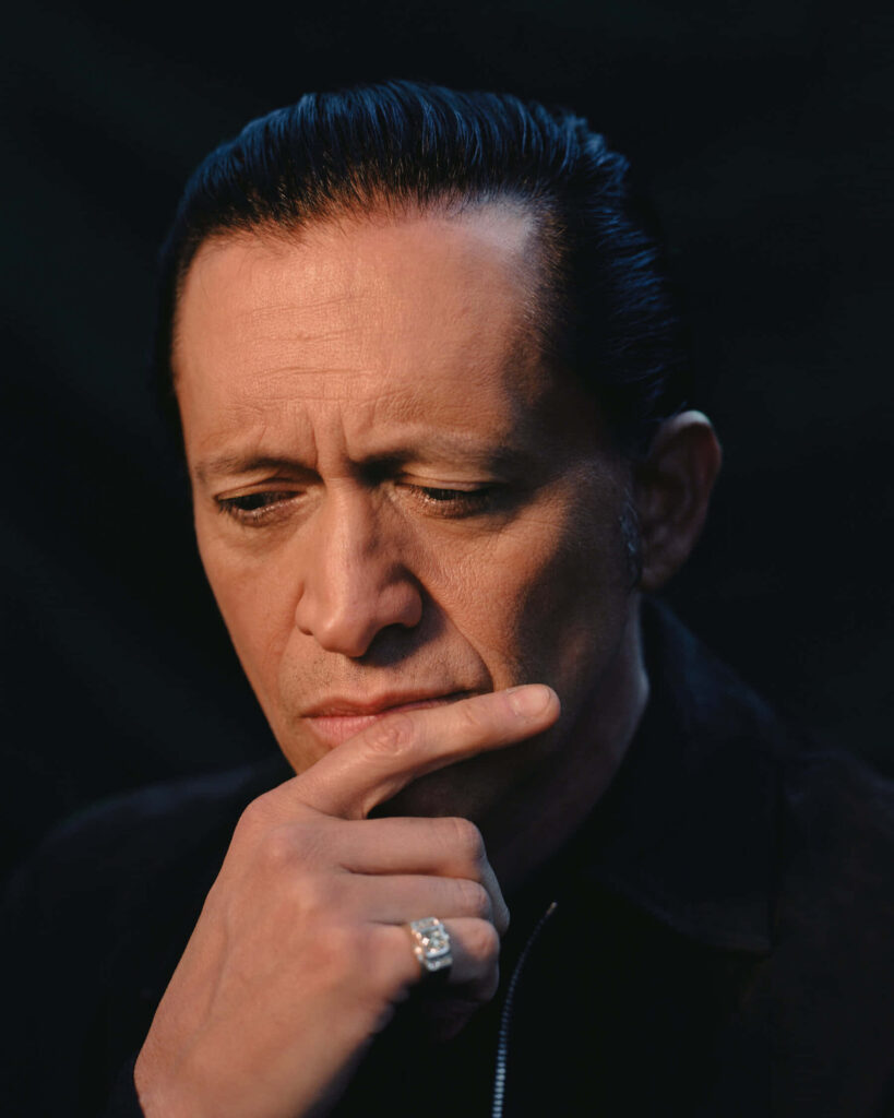 Clifton Collins Jr dramatic portrait with contemplative expression dark blurred background wallpaper