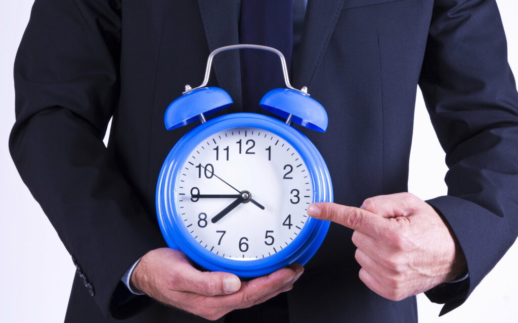Time is Money: A Businessman Races Against the Clock Wallpaper