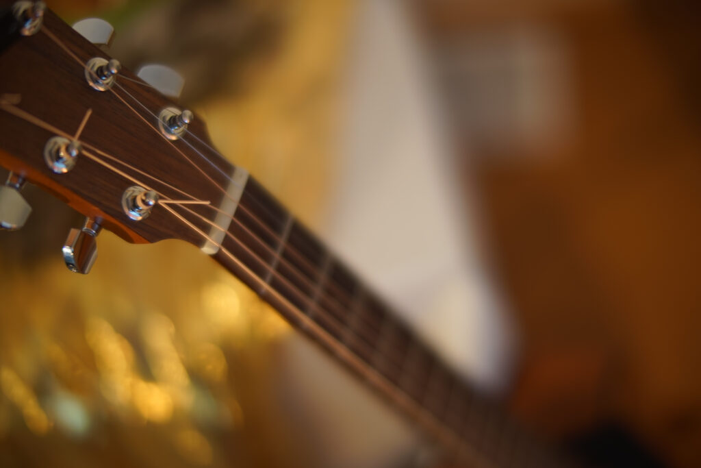 Acoustic Guitar Neck Close-Up Wallpaper with Soft Blurred Background