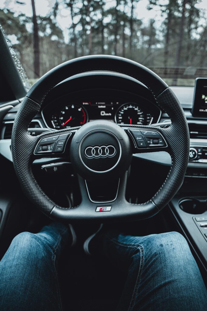 Close-Up of Audi Steering Wheel: Sophisticated Design and Craftsmanship Wallpaper