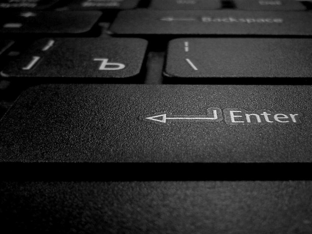 Close-Up Black Tablet Keyboard: Focus on Enter Key & Modern Design Wallpaper