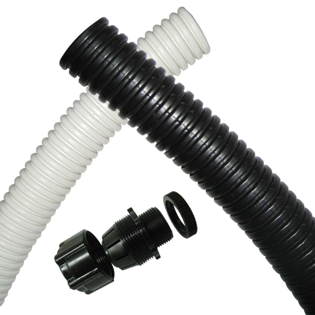 Flexible Black & White PVC Pipes: Close-Up with Fittings Background Wallpaper