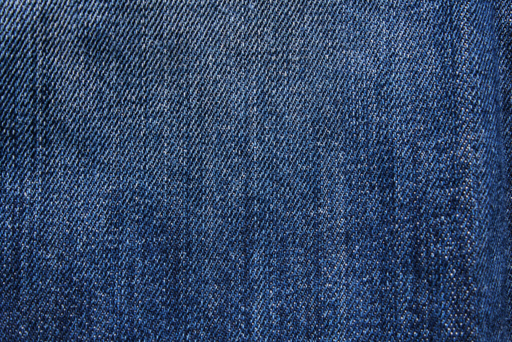 Close-Up Blue Jeans Fabric Wallpaper - Classic Denim Texture Background