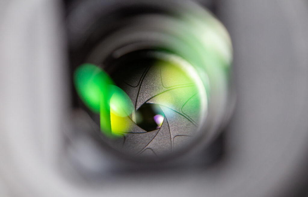 Intricate Camera Lens Close-Up: Vibrant Aperture Blades Wallpaper