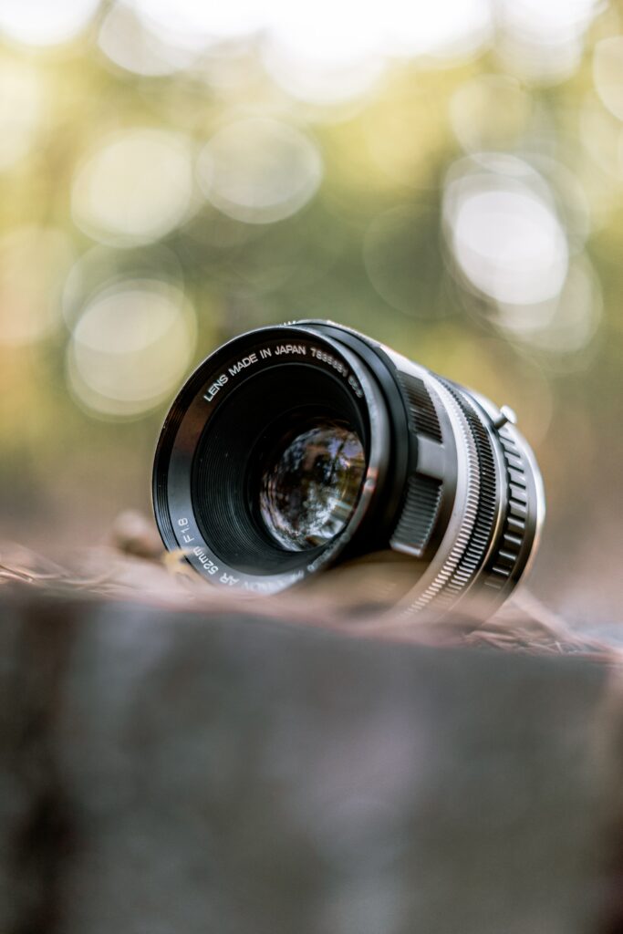 Stunning Camera Lens Close-Up Wallpaper with Artistic Bokeh Effect