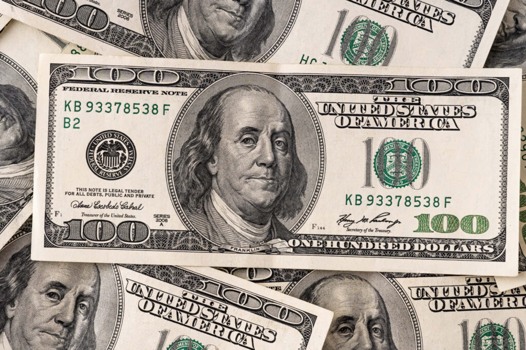 Financial Fortune: A Closeup View of a $100 Bill Stack, Ideal Desktop Wallpaper