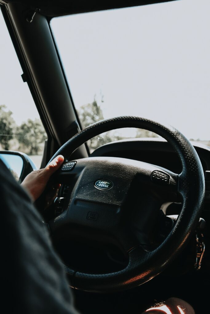High-Res Close-Up of Steering Wheel Capturing Driver Control Wallpaper