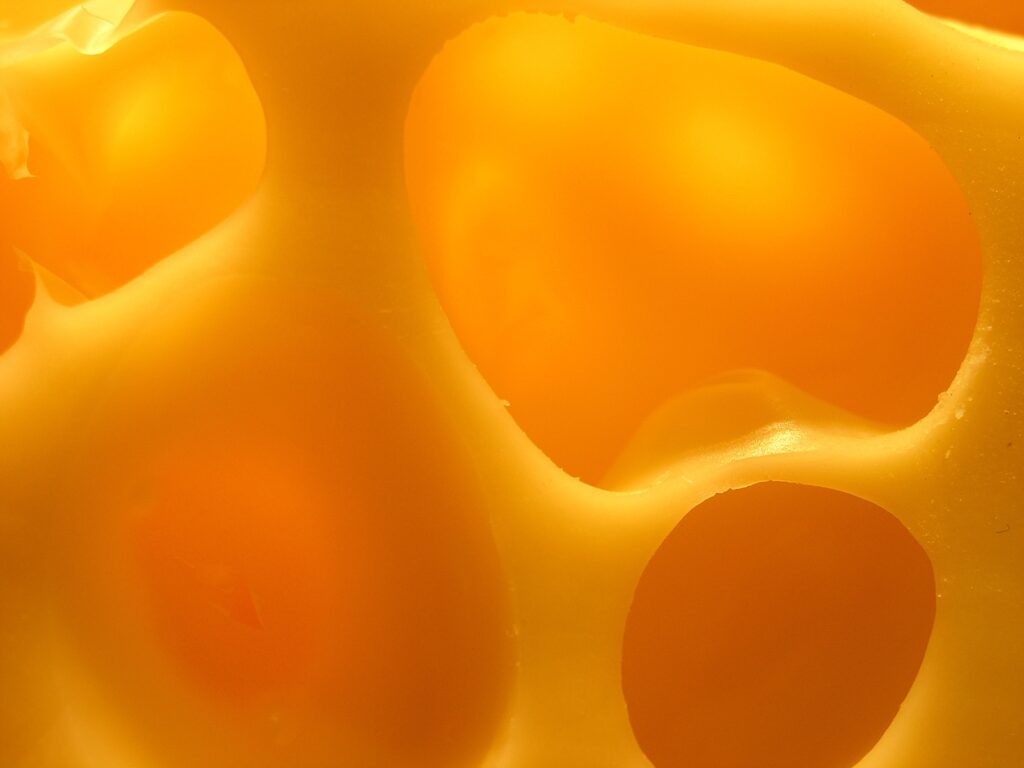 Textured Cheese Close-Up with Warm Shades | Creamy Wallpaper Background