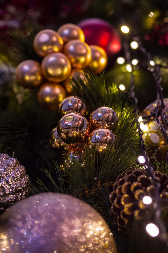 Festive Close-Up: Shimmering Christmas Tree Ornaments & Lights Wallpaper