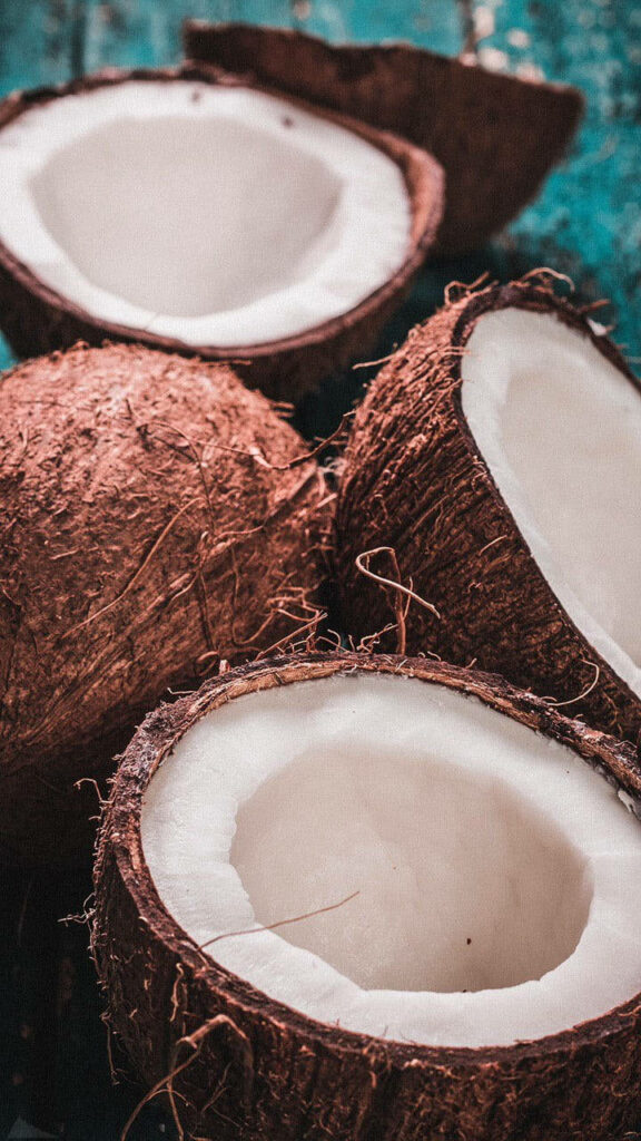 Close-Up Coconut Wallpaper: Brown Shells & Creamy White Interiors