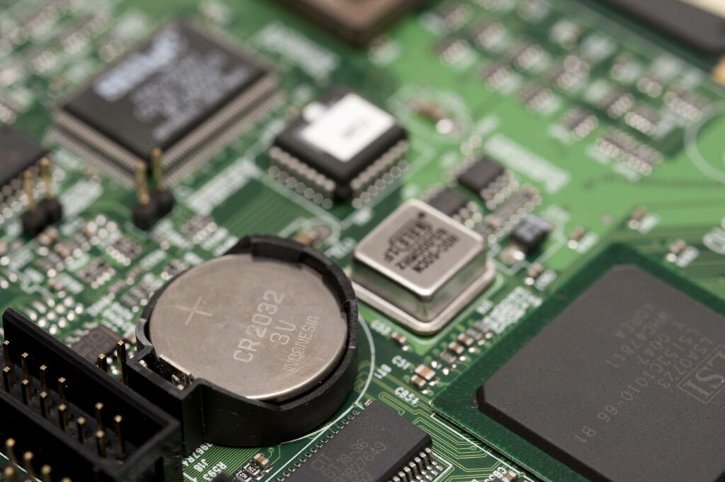 Close-Up of Computer Motherboard & 3V BIOS Battery Wallpaper