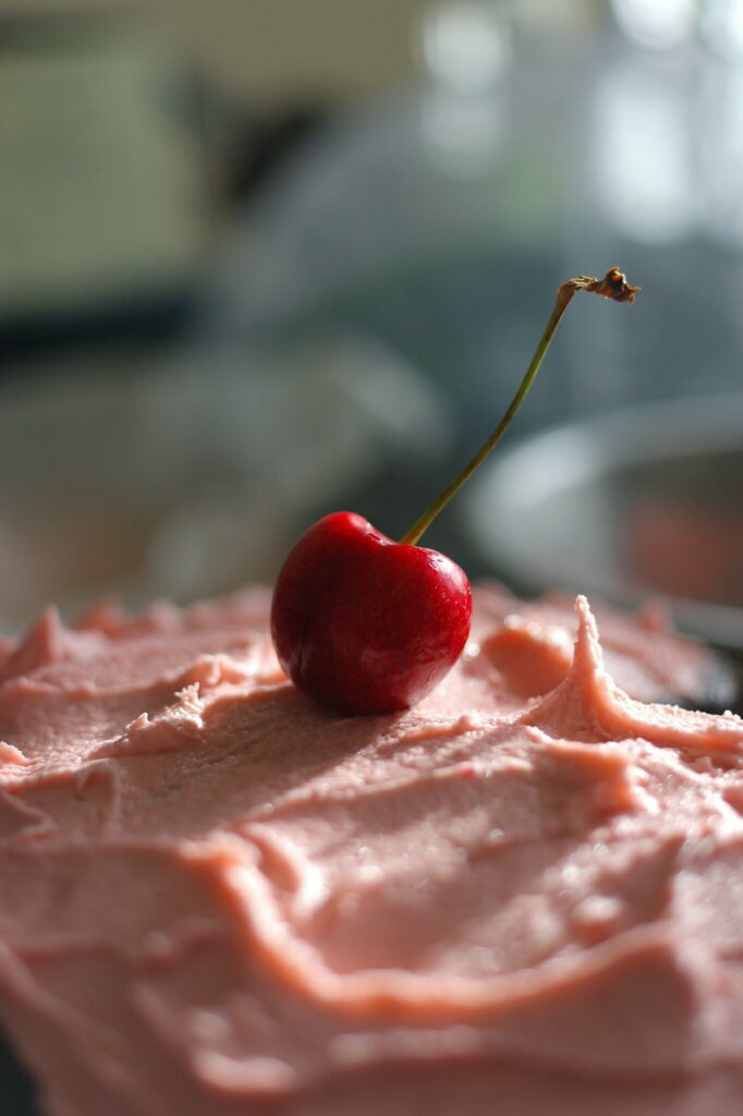 Close-Up Creamy Dessert with Cherry | Soft Blurred Wallpaper Background
