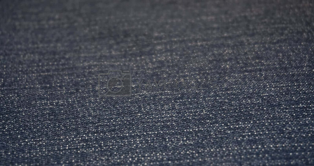 Close-Up Denim Fabric Texture Wallpaper in Dark Blue Background