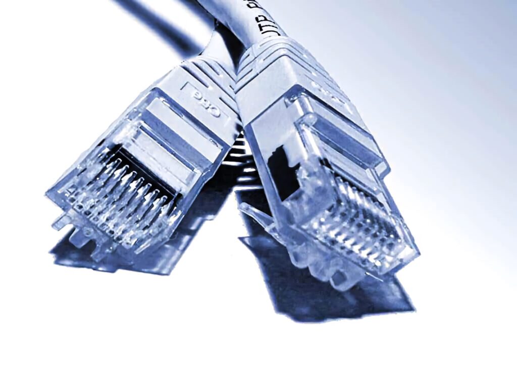 Close-up of translucent Ethernet cables with fine wiring on a blue gradient tech background wallpaper