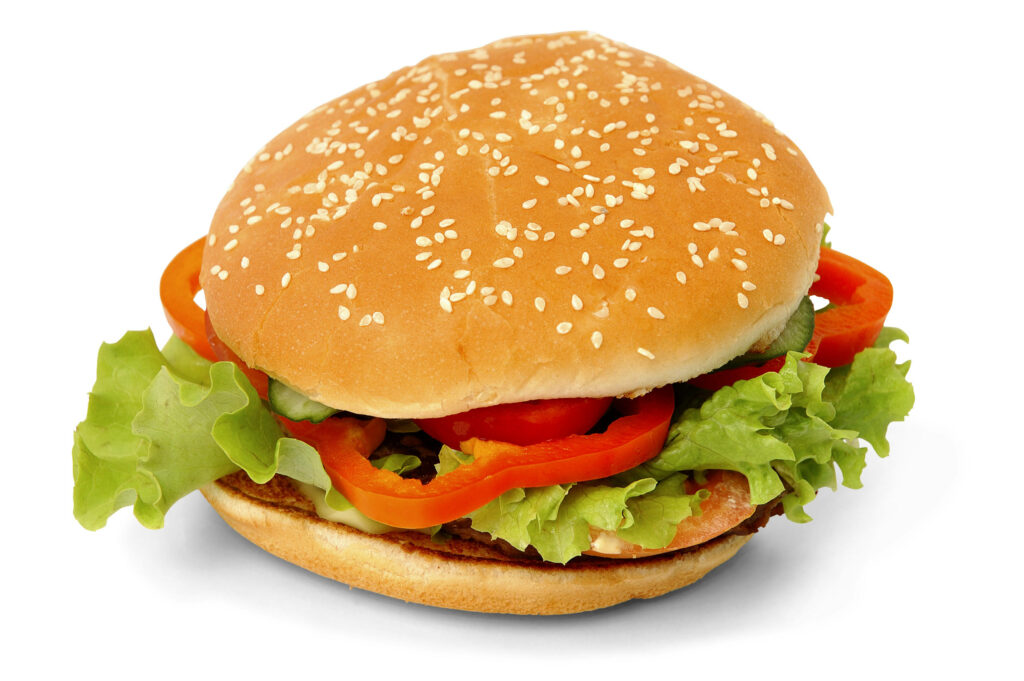 Fresh Cheeseburger Close-Up: Sesame Bun & Crisp Veggies Wallpaper