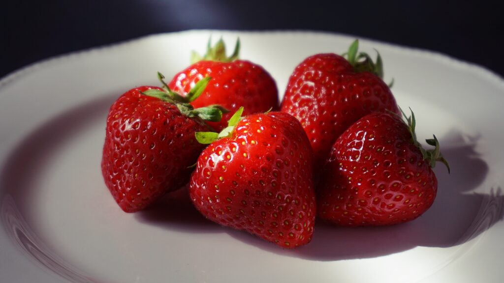 Vibrant Red Strawberry Wallpaper: Close-Up Macro Texture Background