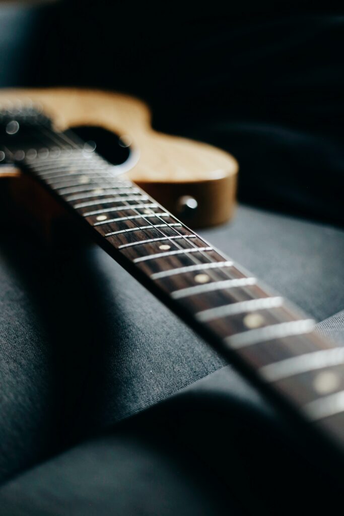 Macro Guitar Fretboard Wallpaper: Intricate Strings & Craftsmanship