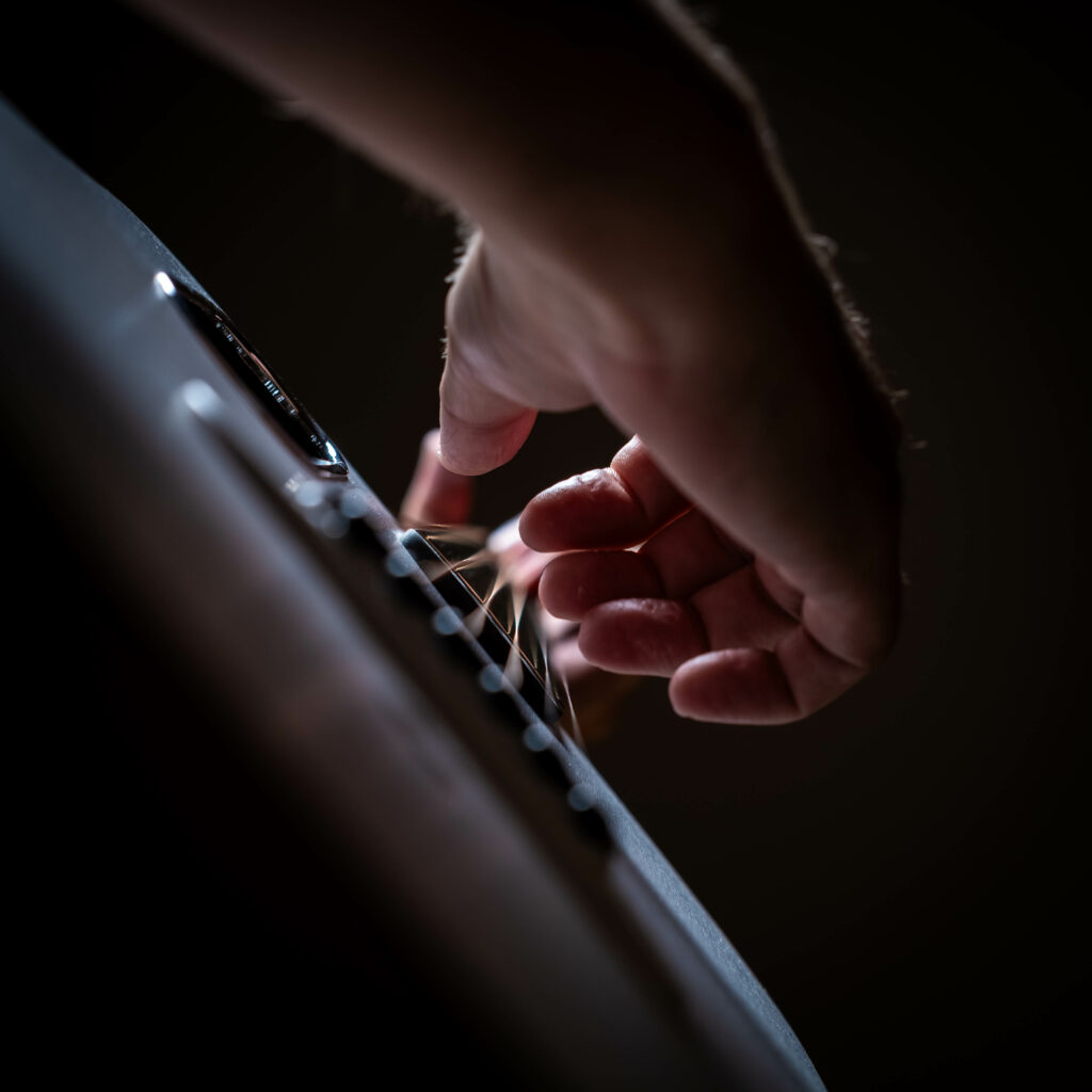 Close-Up Guitar Strings Wallpaper: Music and Artistry in Focus