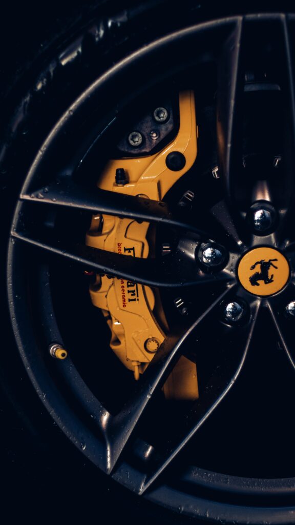 Close-Up of Lamborghini Wheel: Alloy Rims & Yellow Brake Caliper Wallpaper