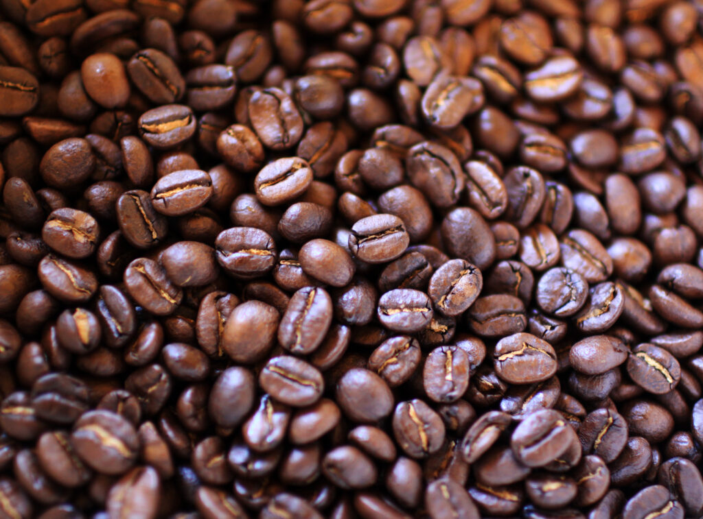 Macro Coffee Beans: Rich Brown Tones & Textured Wallpaper Background