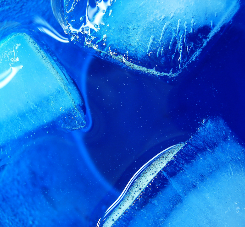 Vibrant Blue Ice Cube Close-Up Macro: Textured Frozen Water Wallpaper