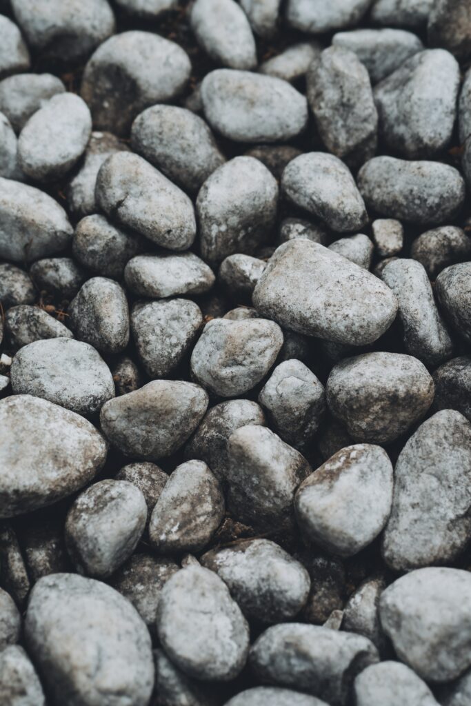 Macro Shot of Textured Gray Pebbles - Nature Wallpaper Background