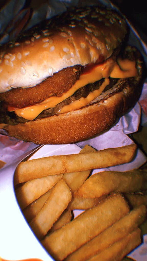 Close-Up McDonald's Cheeseburger & Crispy Fries Wallpaper Background
