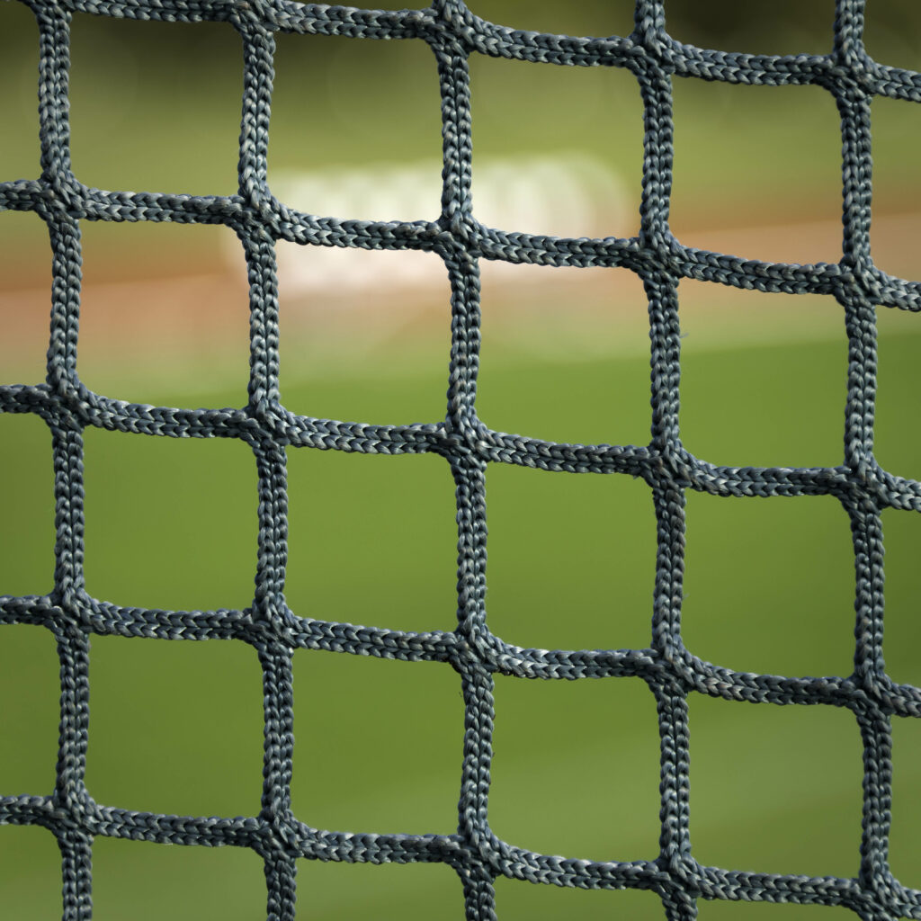 Close-Up Mesh Fabric Wallpaper with Grid Pattern on Green Background