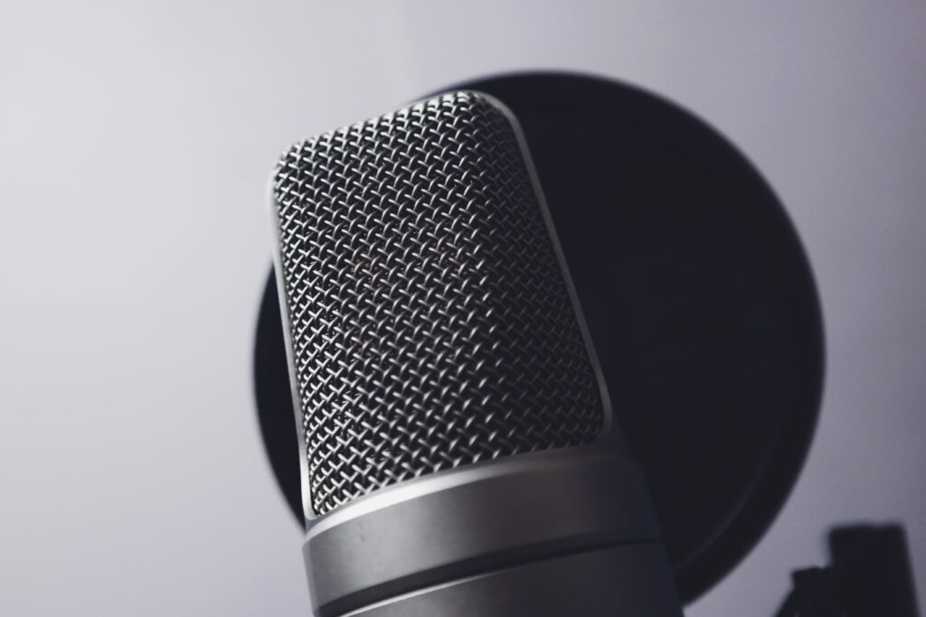 Stylish Microphone Wallpaper: Sleek Design & Metallic Grill Background