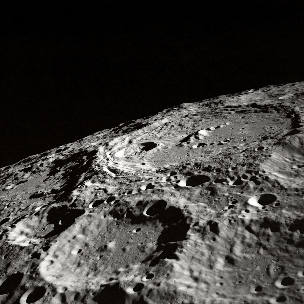 Rugged Moon Surface: Detailed Close-Up Wallpaper Background