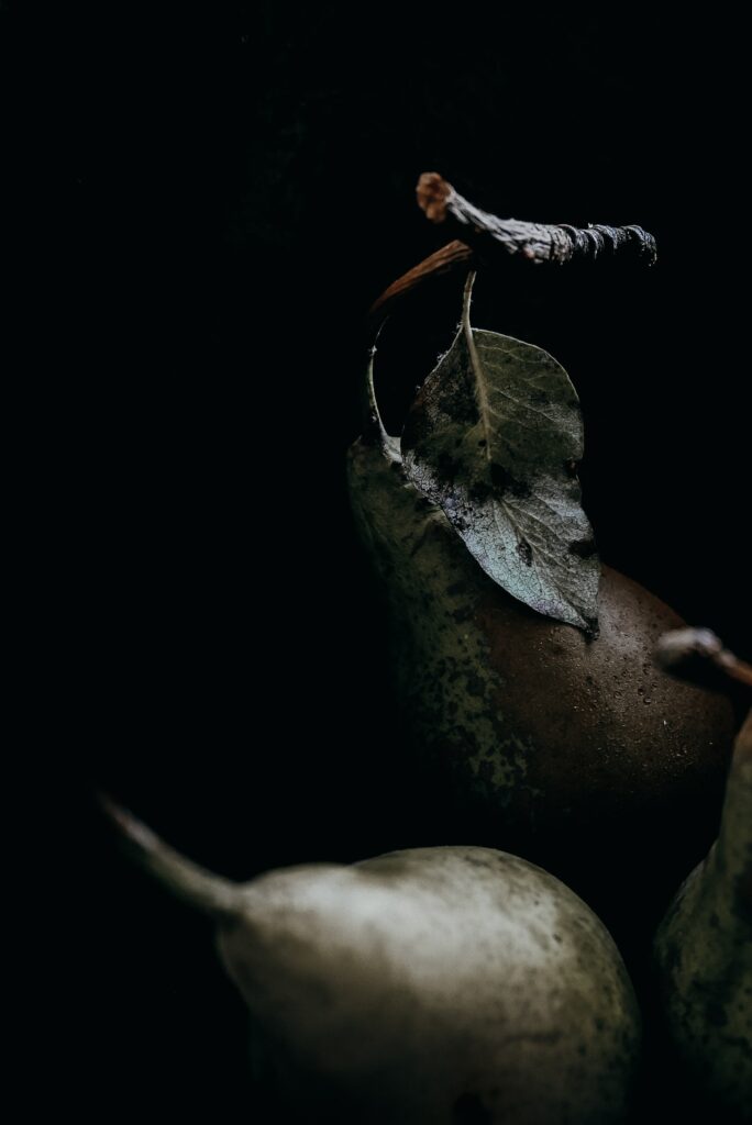 Close-Up Pears Wallpaper: Natural Texture on Dark Moody Background