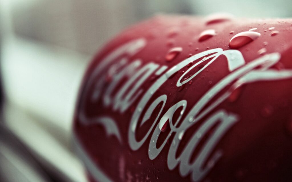 Refreshing Red Coca-Cola Label Close-Up: Iconic Wallpaper Background