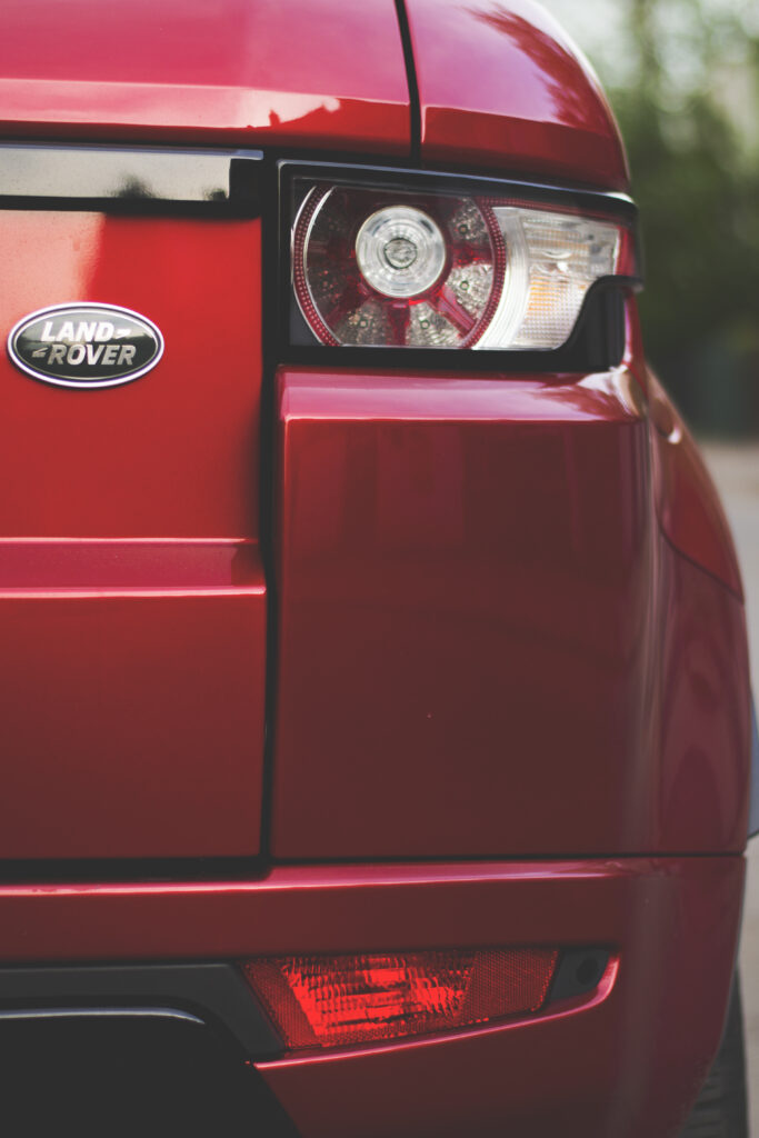 Red Land Rover Close-Up: Stylish Rear View & Taillights Wallpaper