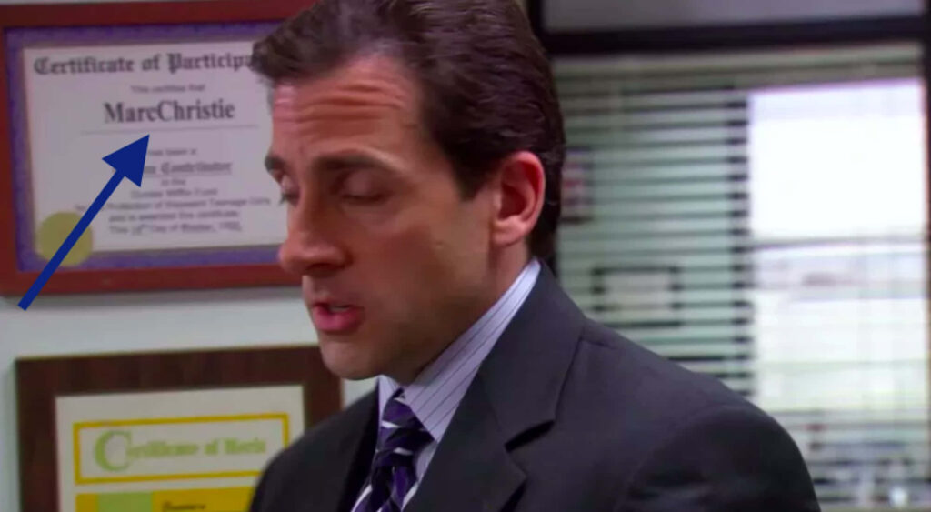 Close-Up of *The Office* Character in Professional Setting with Certificates Wallpaper