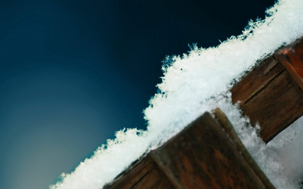 Intricate Snowflakes on Wood: Winter Wallpaper Background