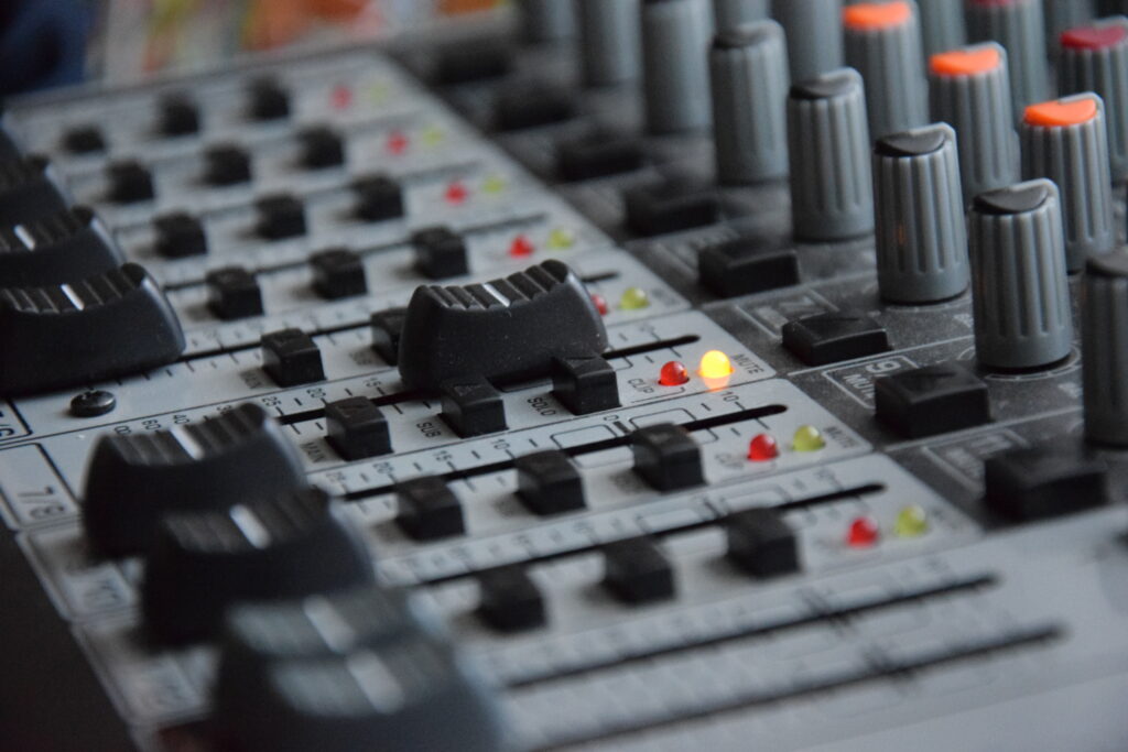 Dynamic Sound Mixer Wallpaper: Illuminated Knobs & Sliders Background