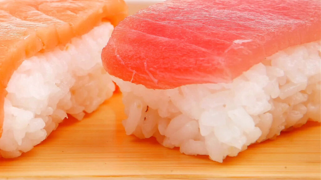 Close-Up Sushi Wallpaper: Fresh Fish on Perfectly Shaped Rice