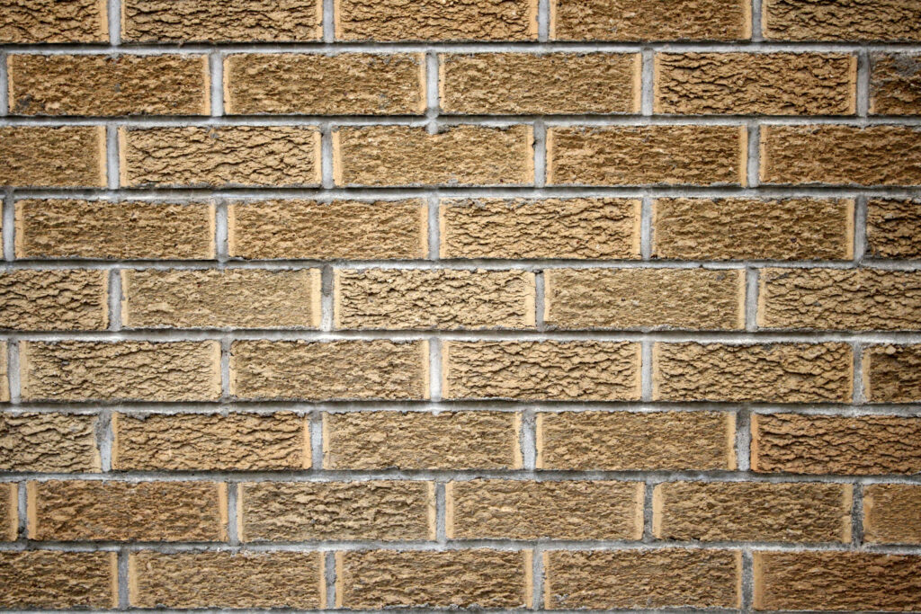 Rustic Textured Brick Wall Wallpaper Background - Close-Up Detail