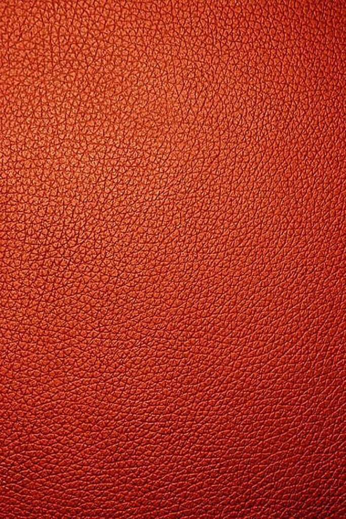 Textured Red Leather Wallpaper: Close-Up of Vibrant Grain & Surface