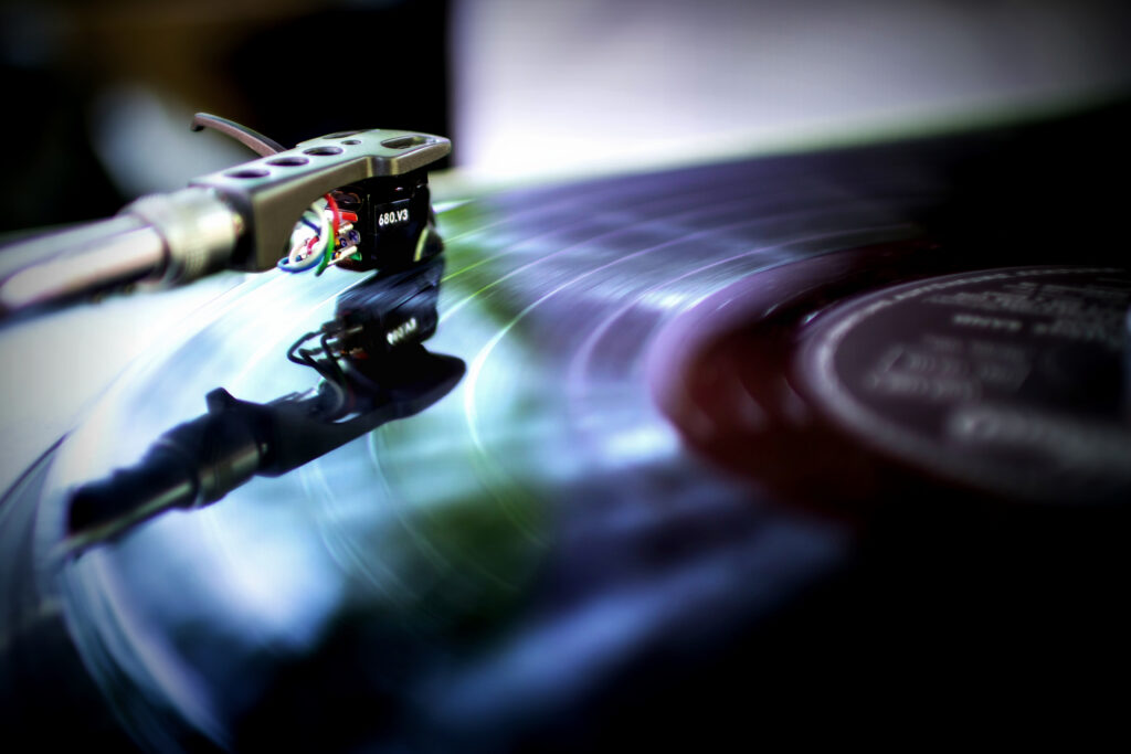 Close-Up Wallpaper of Vinyl Player Cartridge on Spinning Record