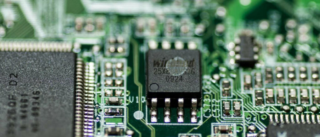 Close-Up of Computer Motherboard: BIOS Microchip & Circuitry Wallpaper