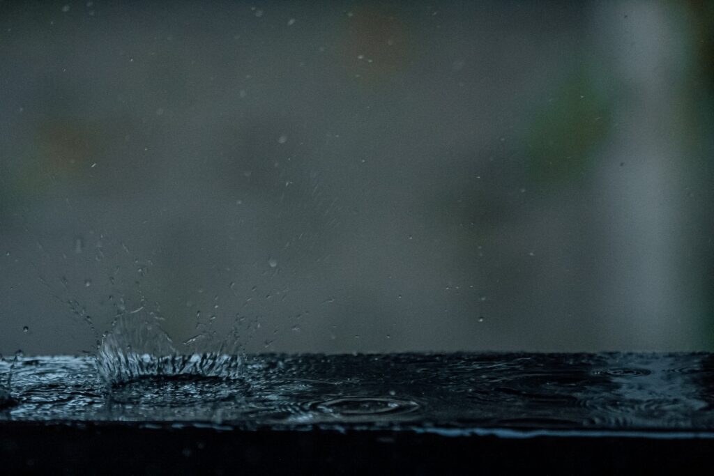 Mesmerizing Water Droplets Wallpaper: Dark Moody Background Close-Up