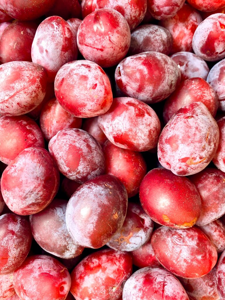 Vibrant Red Plum Wallpaper: Macro Freshness with Frosty Texture