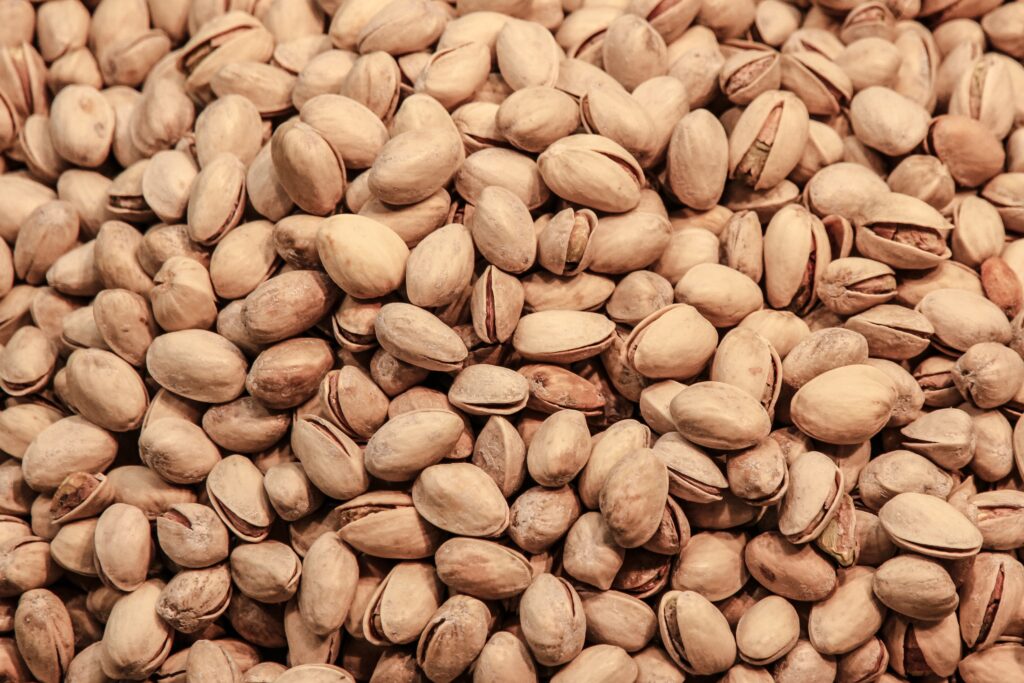 Ripe Roasted Pistachio Nuts Close-Up Wallpaper Background
