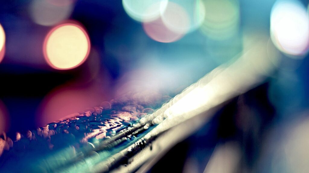 Water Droplets Wallpaper: Close-Up with Soft Light & Colorful Bokeh
