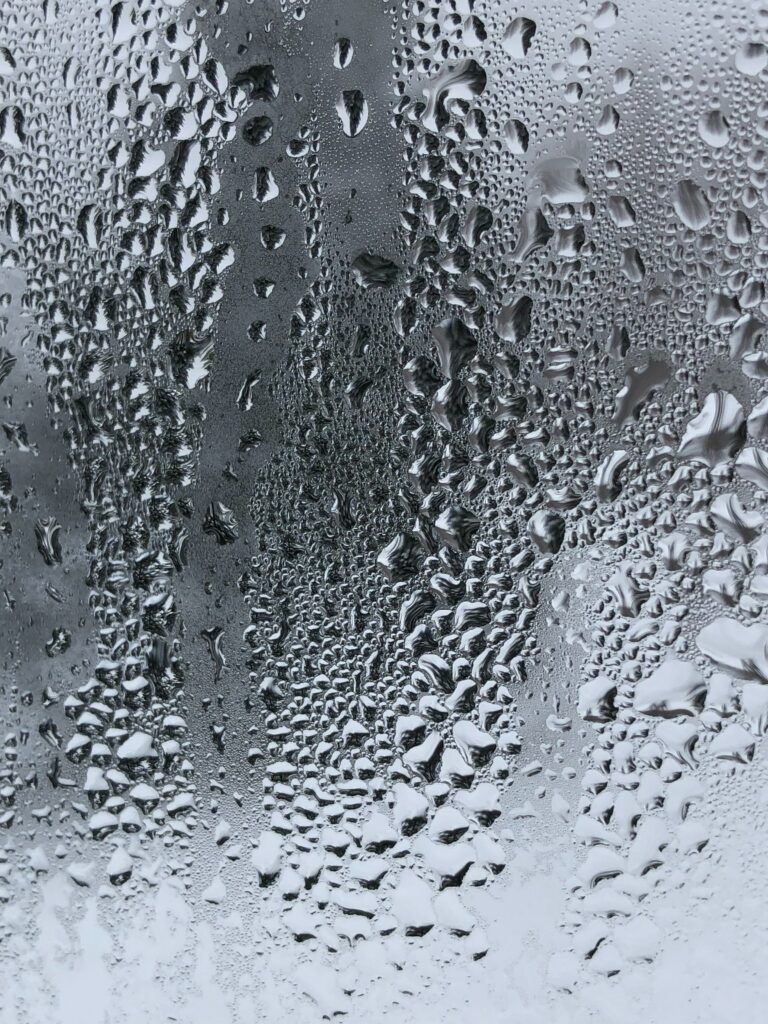 Textured Water Droplets on Glass - Stunning Wallpaper Background