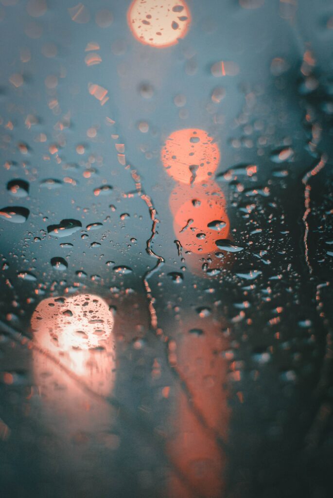 Close-Up Water Drops Wallpaper with Warm Bokeh Background