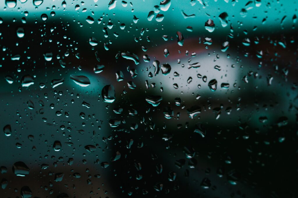 Close-Up Water Drops on Glass: Moody Wallpaper Background
