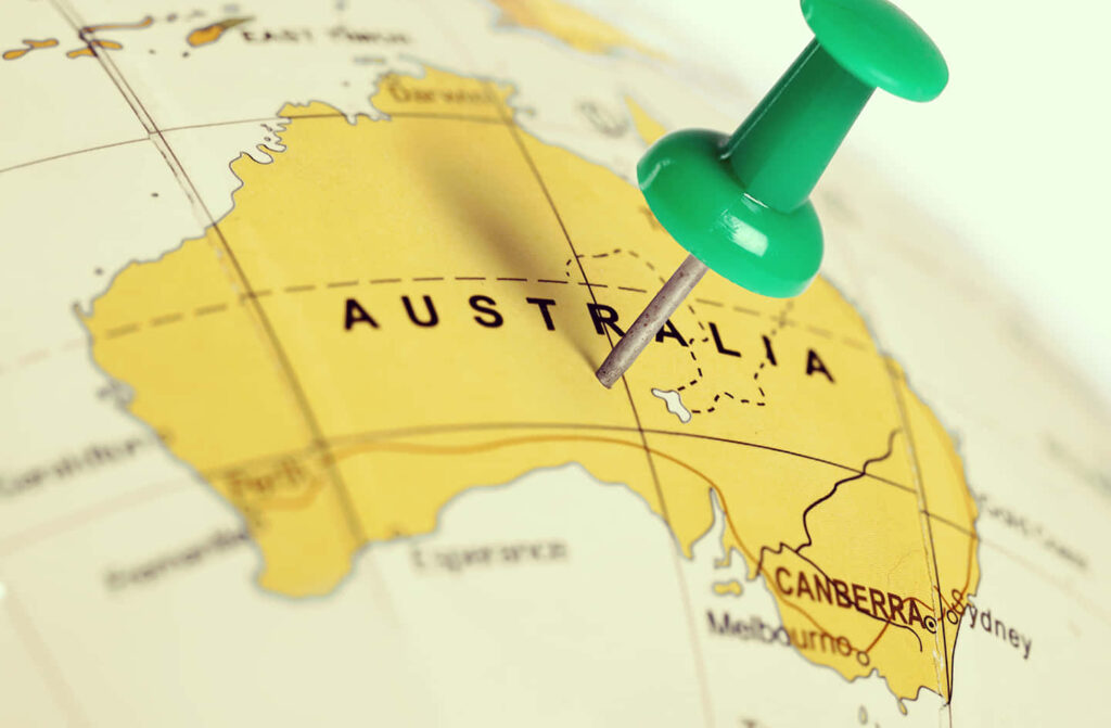 Close-Up World Map Wallpaper: Australia Highlighted with Green Pushpin